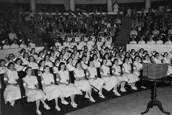 1951 graduates wear the white shoes and hose now permitted during the last six months of training.	Lorraine Bowers Albrecht (DIPLO 1951) donation to the ECBCNHI. Eleanor Crowder Bjoring Center for Nursing Historical Inquiry, University of Virginia School of Nursing.