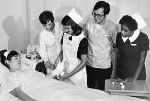 Student nurses' uniforms of the 1970s.	School of Nursing Catalog, The Record, 1978-79.