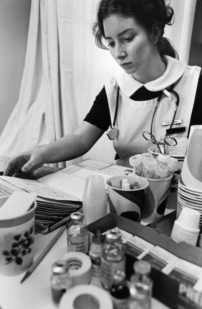 An undergraduate student prepares medications.	Casey Weissenborn (later Finn), BSN 1976.