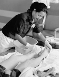 A student nurse washing a patient's feet. The gentle human touch remains a vital part of nursing.	Eleanor Crowder Bjoring Center for Nursing Historical Inquiry, University of Virginia School of Nursing.
