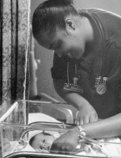 A student nurse with an infant. The gentle human touch remains a vital part of nursing.	Eleanor Crowder Bjoring Center for Nursing Historical Inquiry, University of Virginia School of Nursing.