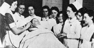 Roy Beazley instructs students in clinical care using 'Mrs. Chase', the first patient simulator. Ruth Repass Shaver Collection.   Eleanor Crowder Bjoring Center for Nursing Historical Inquiry, University of Virginia School of Nursing.
	