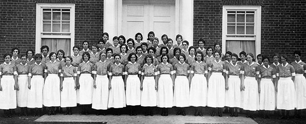 1930s 'probies' wear the blue uniform dress without bib or cap. Nursing School class photo, Albert and Shirley Small Special Collections Library, University of Virginia.  E. H. Robbins, photographer.