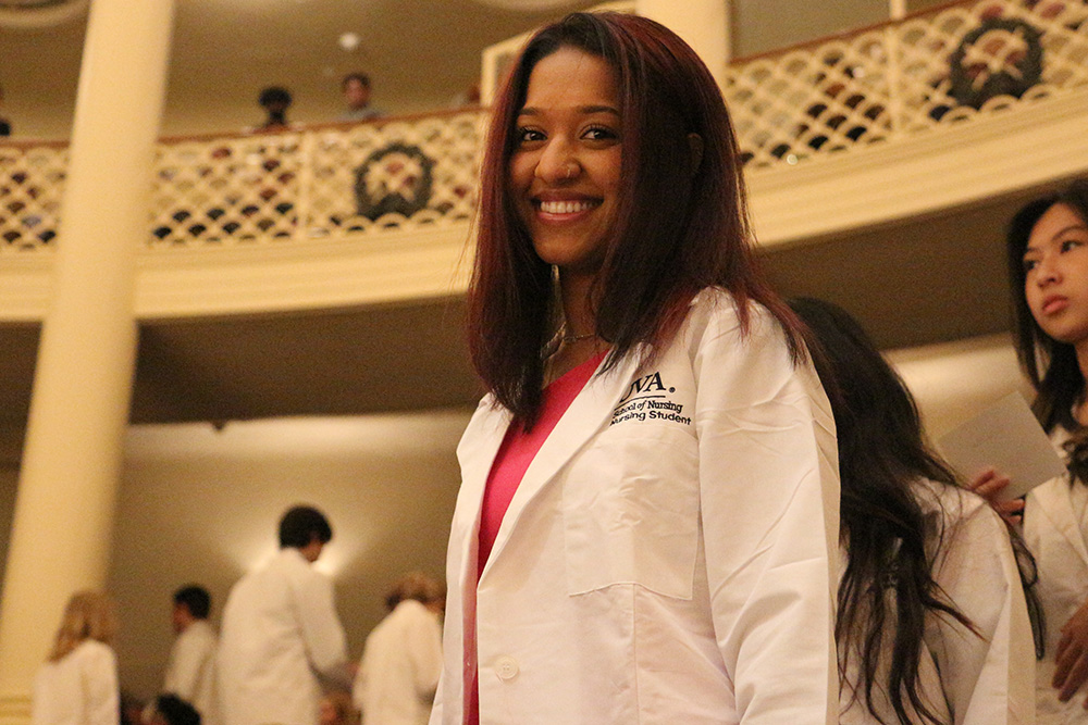 A second-year student earns her White Coat at the 2022 Pinning, Awards, and White Coat ceremony.