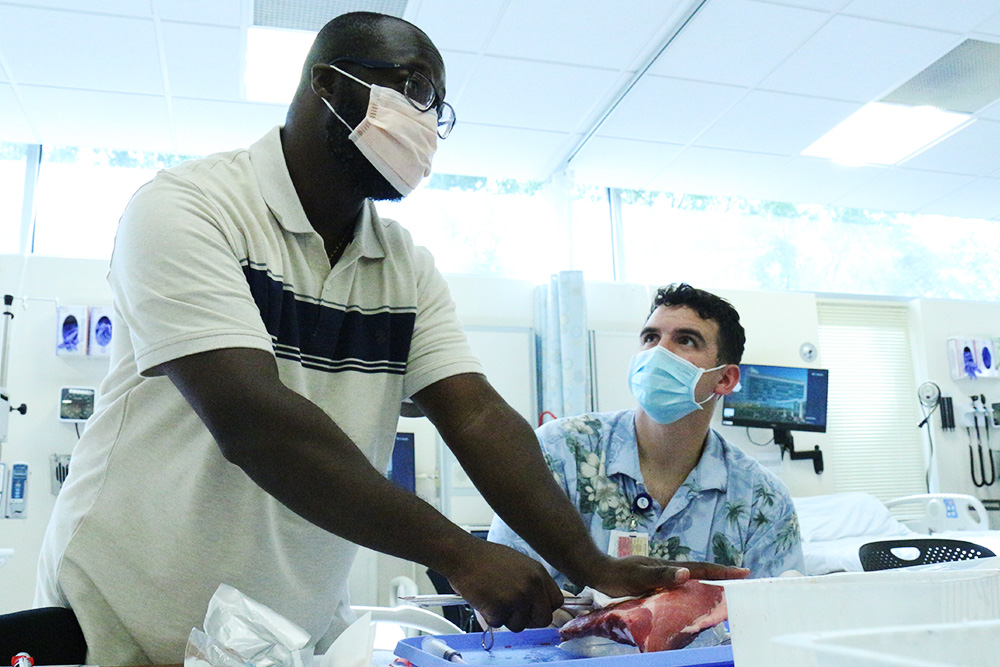 AGACNP students being taught how to place chest tubes by prof Kwame Akuamoah Boateng in the Clinicial Simulation Learning Center.