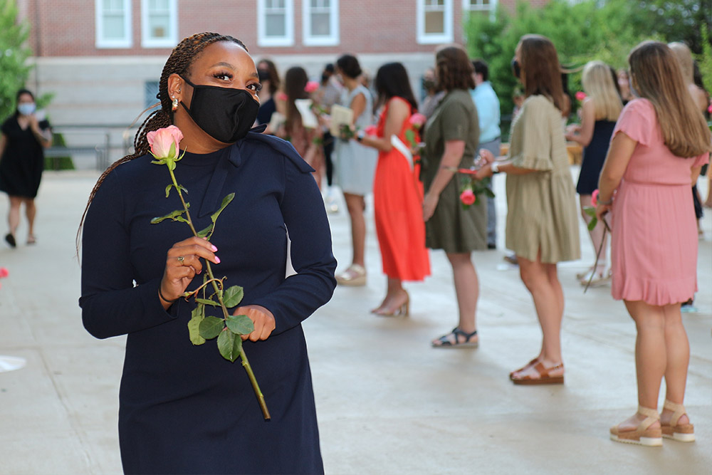A member of the BSN Class of 2021 receives a rose at a celebratory reception