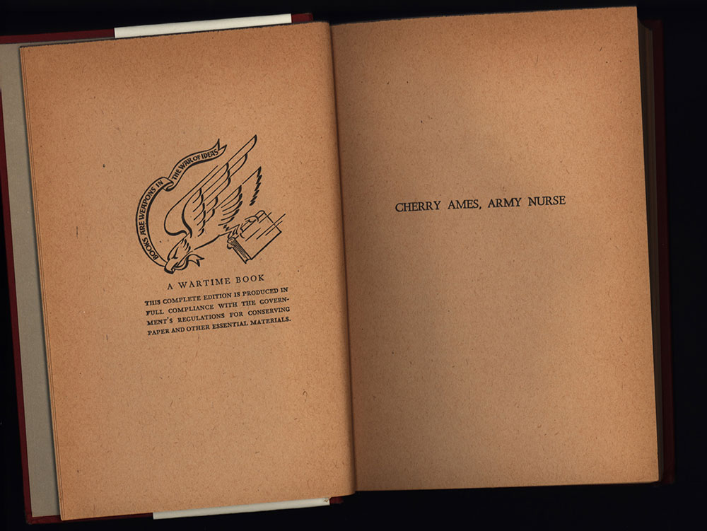 Inside cover page from Cherry Ames Flight Nurse shows wartime motto saying, Books are weapons in the war of words