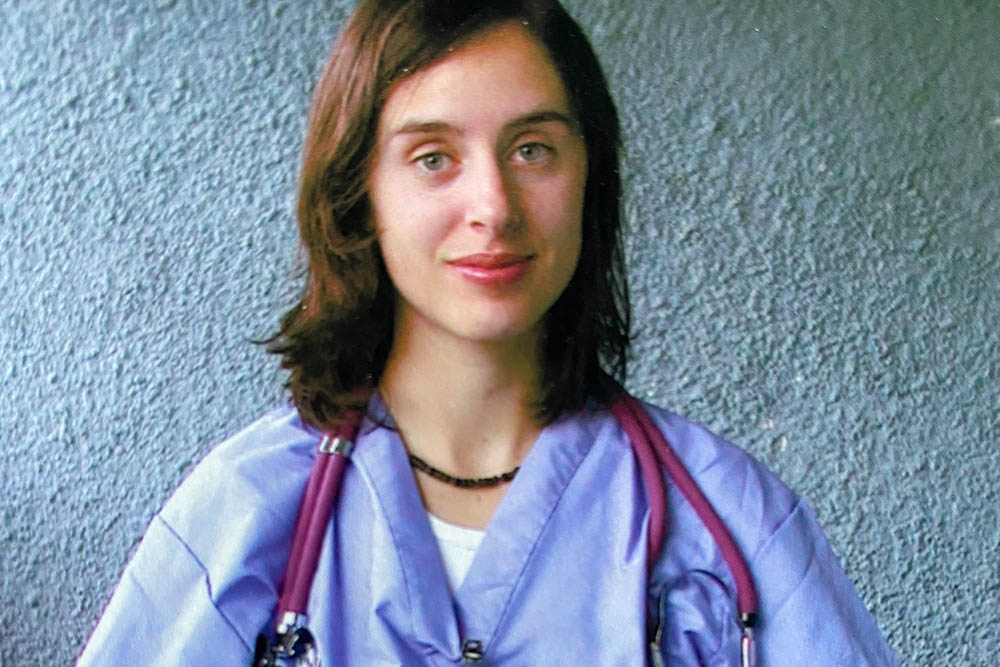 RN to BSN student and neurology nurse Christina Salidis in scrubs