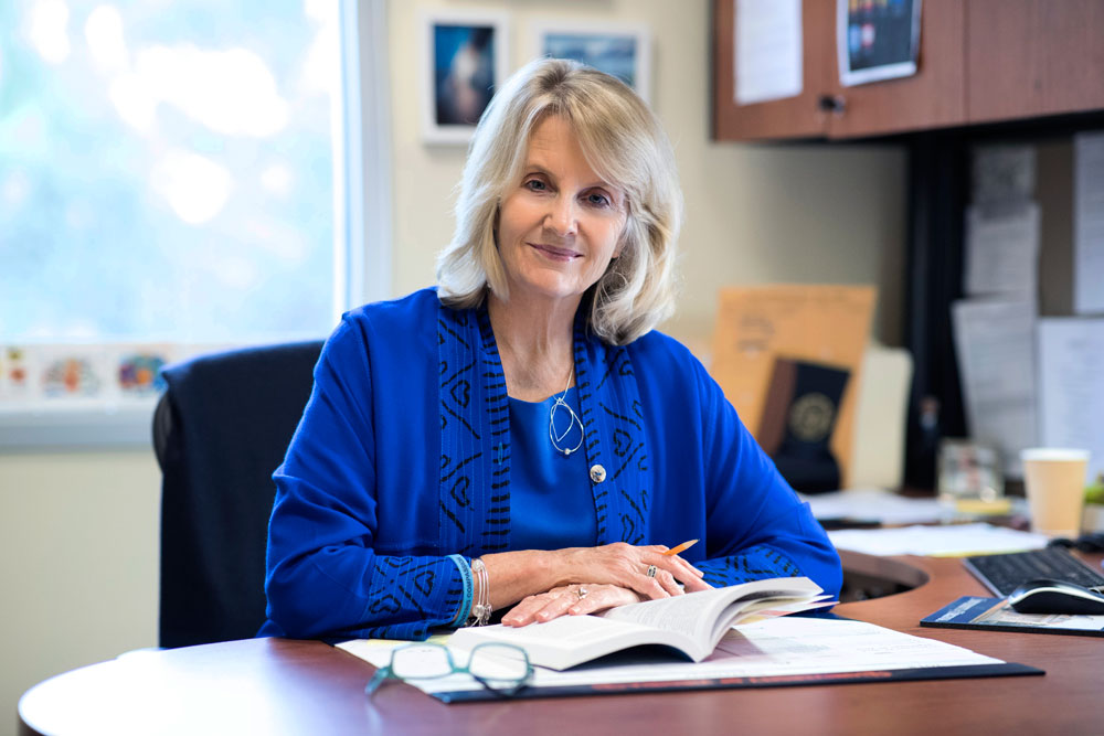 Clareen Wiencek, palliative care NP and professor, at her desk