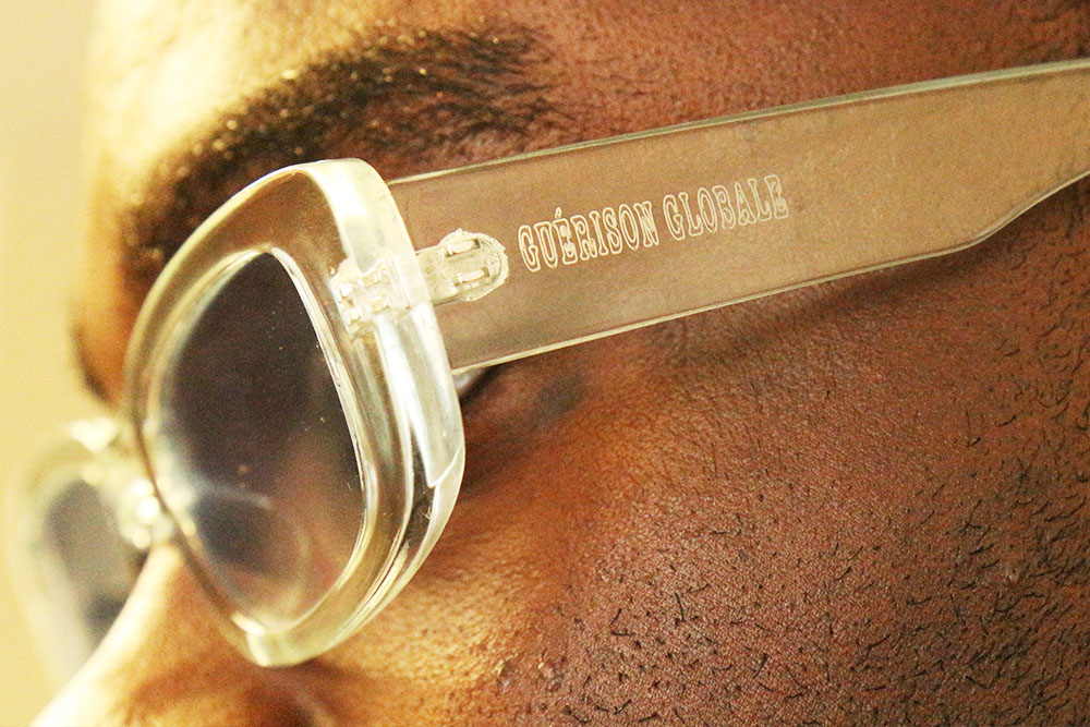Nursing student Davon Okoro models his Guerison Globale fashion creations, including his branded glasses.
