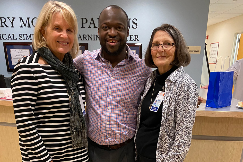 Kwame Akuamoah-Boateng, SCCM Fellow, poses with Clareen Wiencek and Mary Dievert