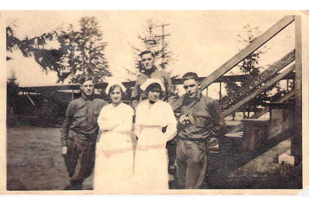 Nurse Lula Owl with another nurse and soldiers during wartime