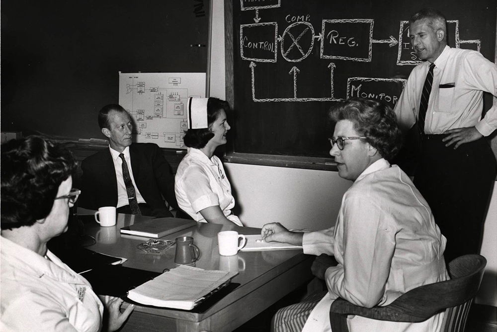 A medical team during a planning session prior to recording