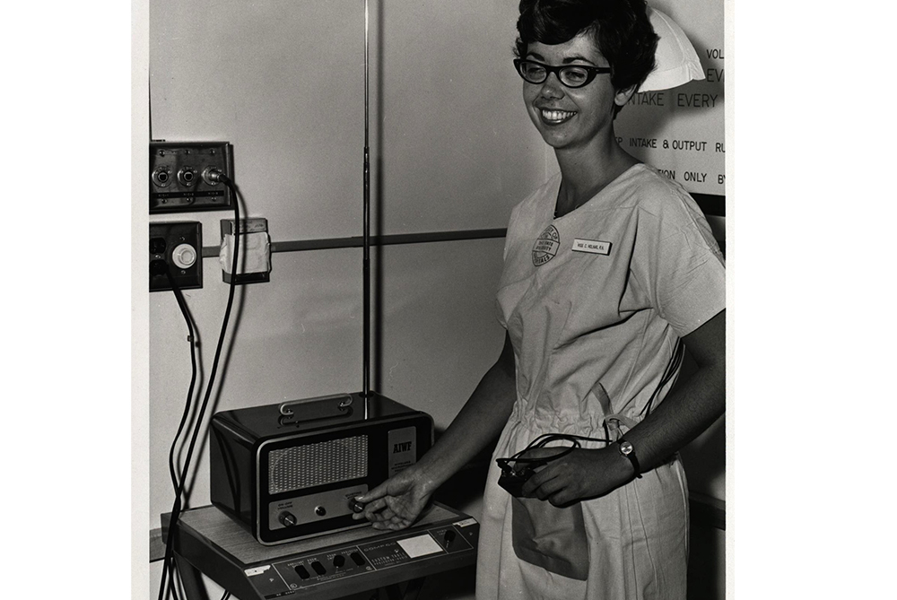 A  bedside nurse wears a mike for audio recording