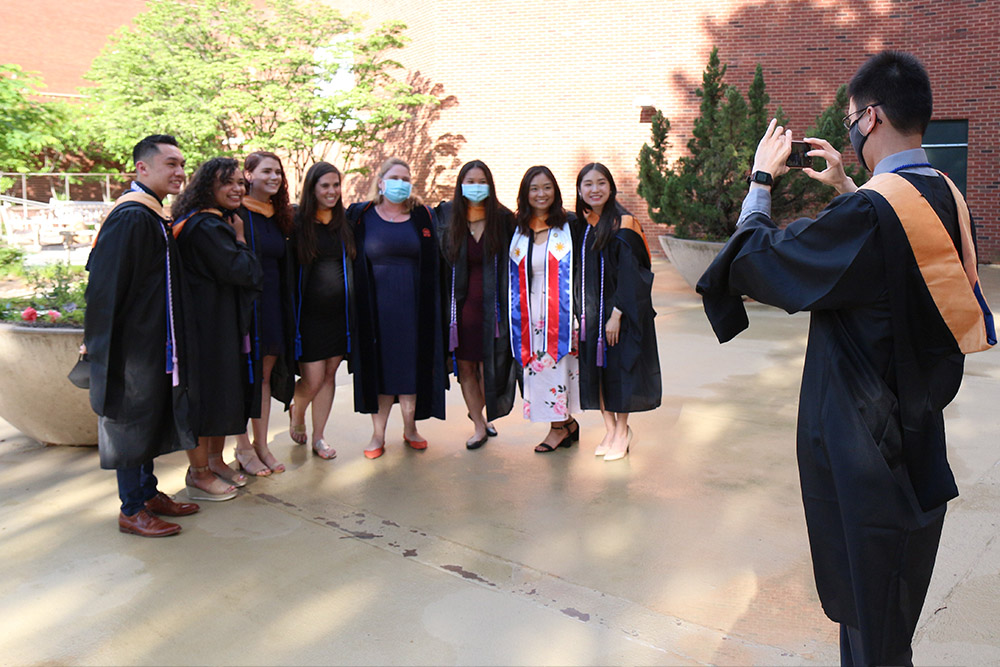 Outside McLeod Hall, Sarah Craig poses with members of the CNL Class of 2021