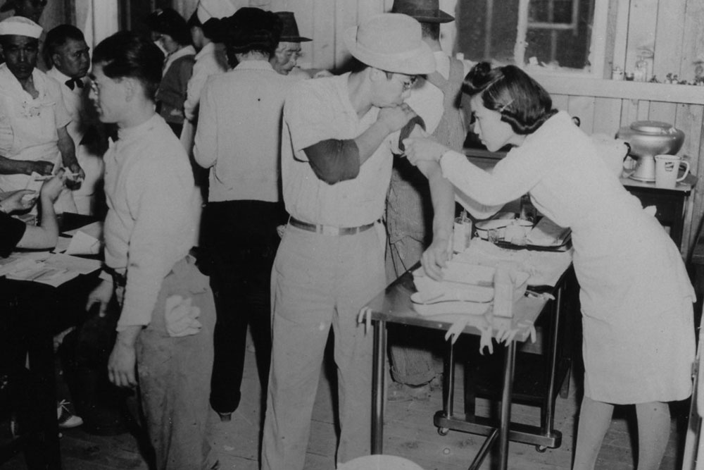 Vaccinations for newcomers at Manzanar Detention Center, c. 1942.