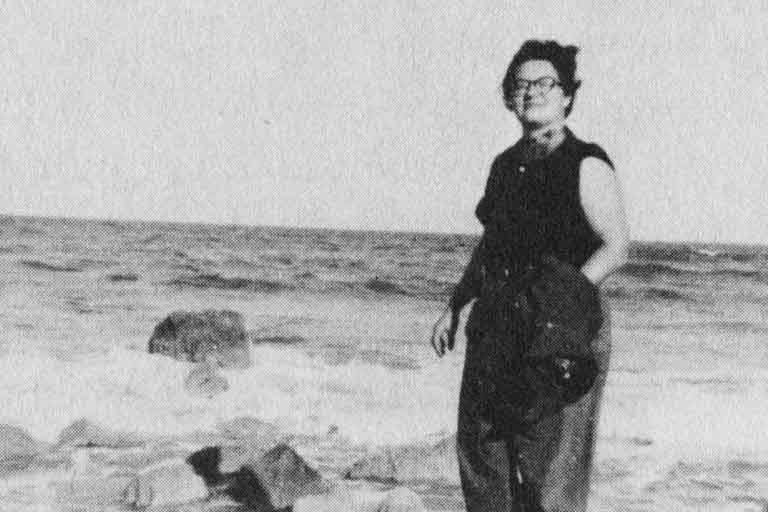 Shirley Willer stands on beach