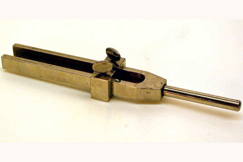 An image of an adjustable tuning fork from the 1890s.