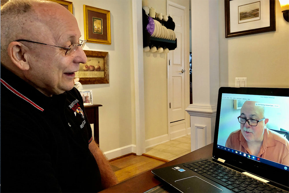 A cancer survivor receives a virtual visit from UVA nurse Alan Cupp, part of an intervention created by professor Pam DeGuzman.