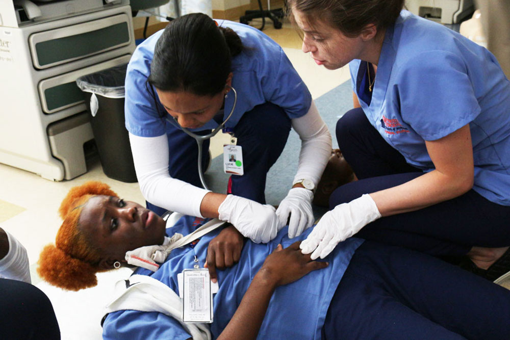 Nursing students taking part in a diaster simulation