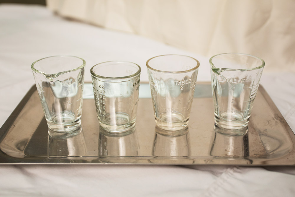 Glass medicine cups from the Bjoring Center.