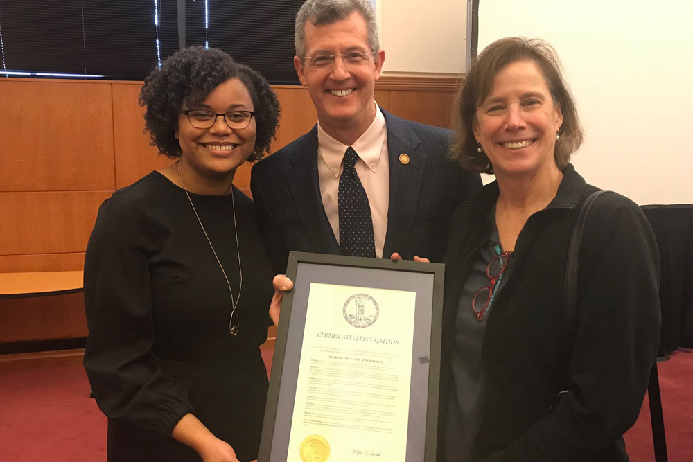 Natasha Coleman BSN student with VA Secretary of Health and Human Services Daniel Carey and Kim Carey, RN, in the Richmond State House.