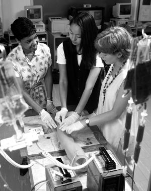 Undergraduate students practice clinical skills in the Laboratory for Clinical Learning.	Eleanor Crowder Bjoring Center for Nursing Historical Inquiry, University of Virginia School of Nursing.