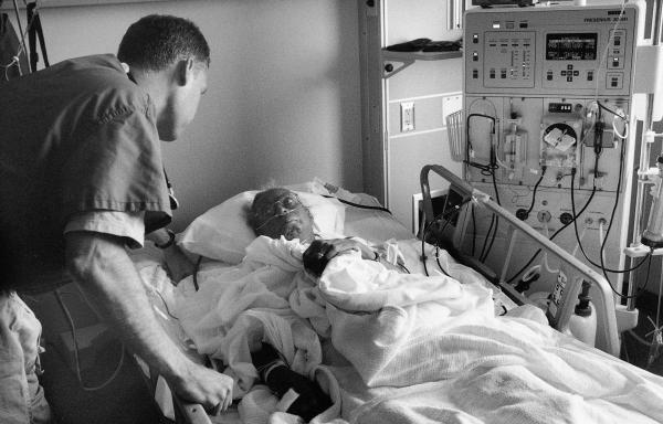 An RN to BSN student cares for a patient on renal dialysis.	Eleanor Crowder Bjoring Center for Nursing Historical Inquiry, University of Virginia School of Nursing.